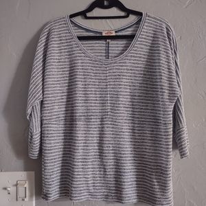 movement top blouse women size M ,features a classic striped pattern in gray.